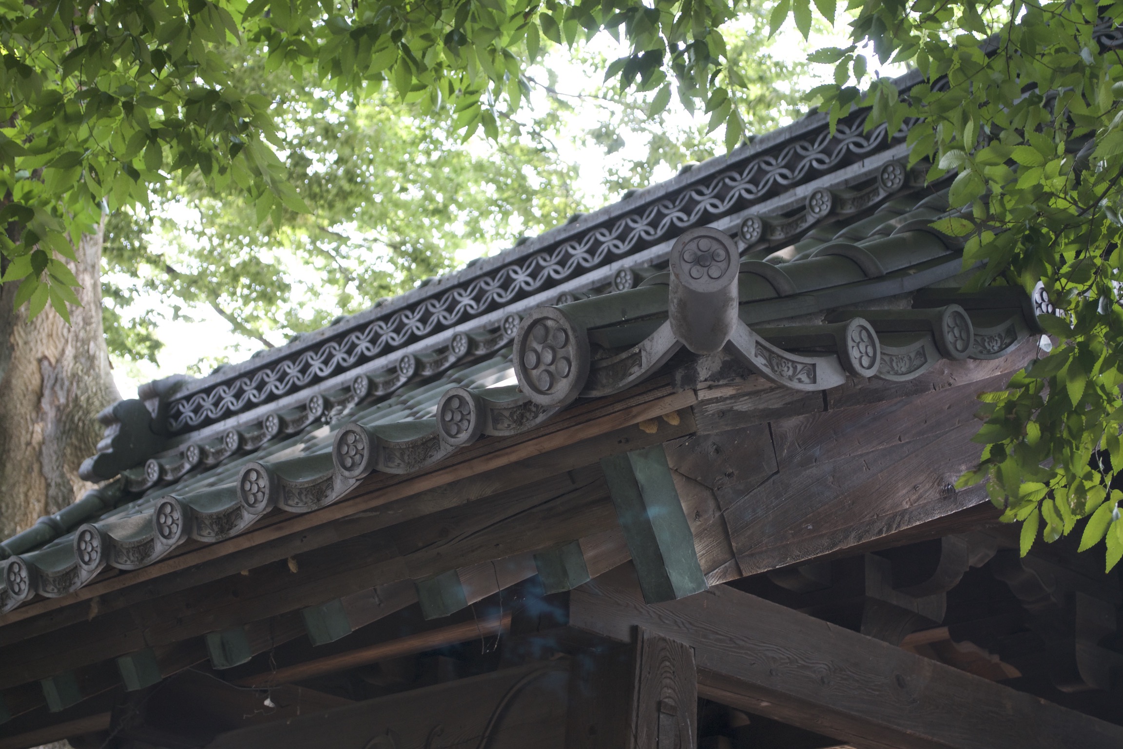 A closeup of roof tiles on a nearby temple.