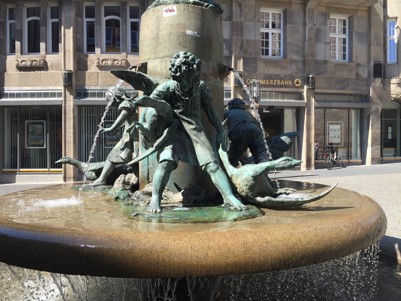 A fountain with bronze children harassing bronze geese.