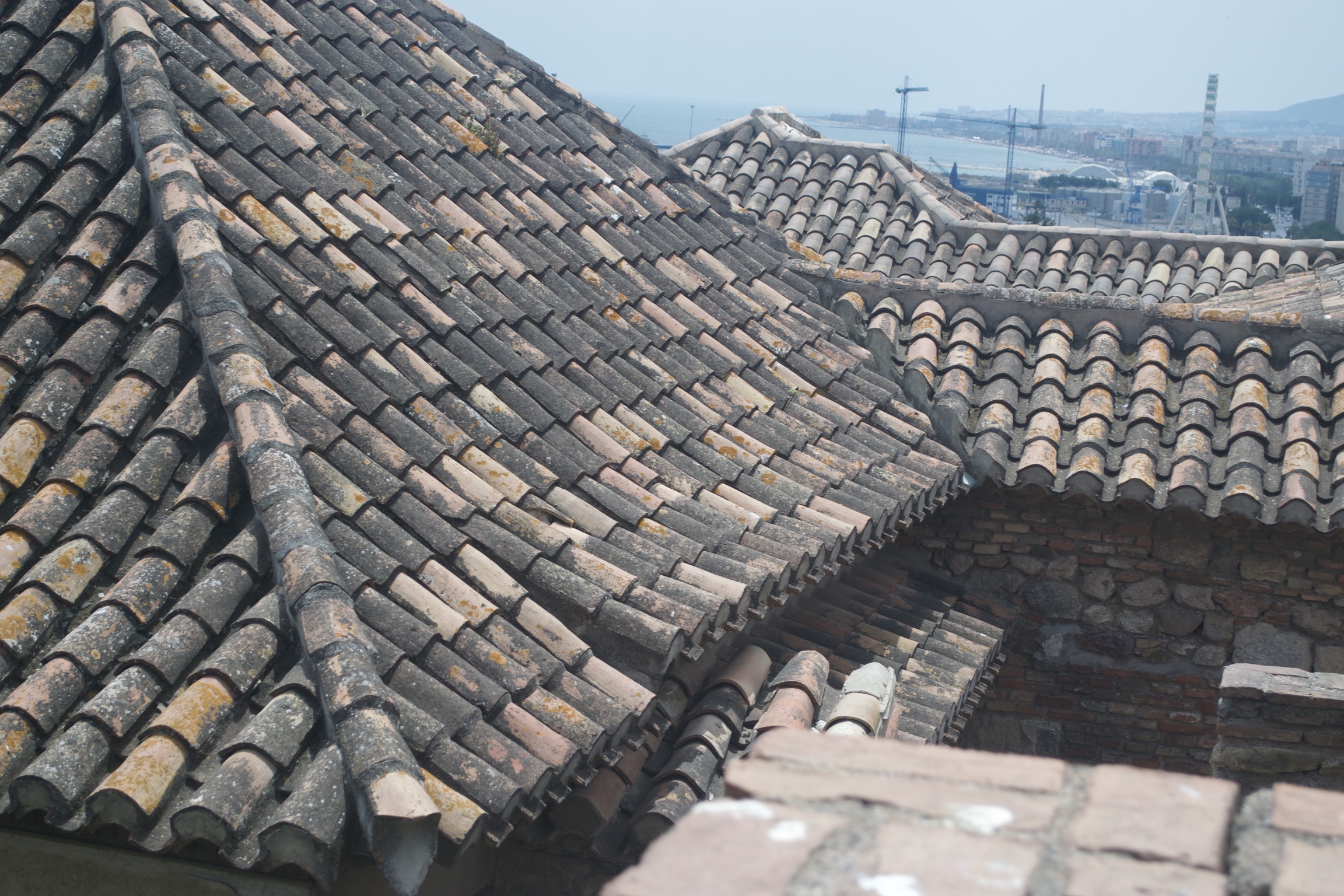 Tiled roofs meet, yielding complicated joints and eaves.